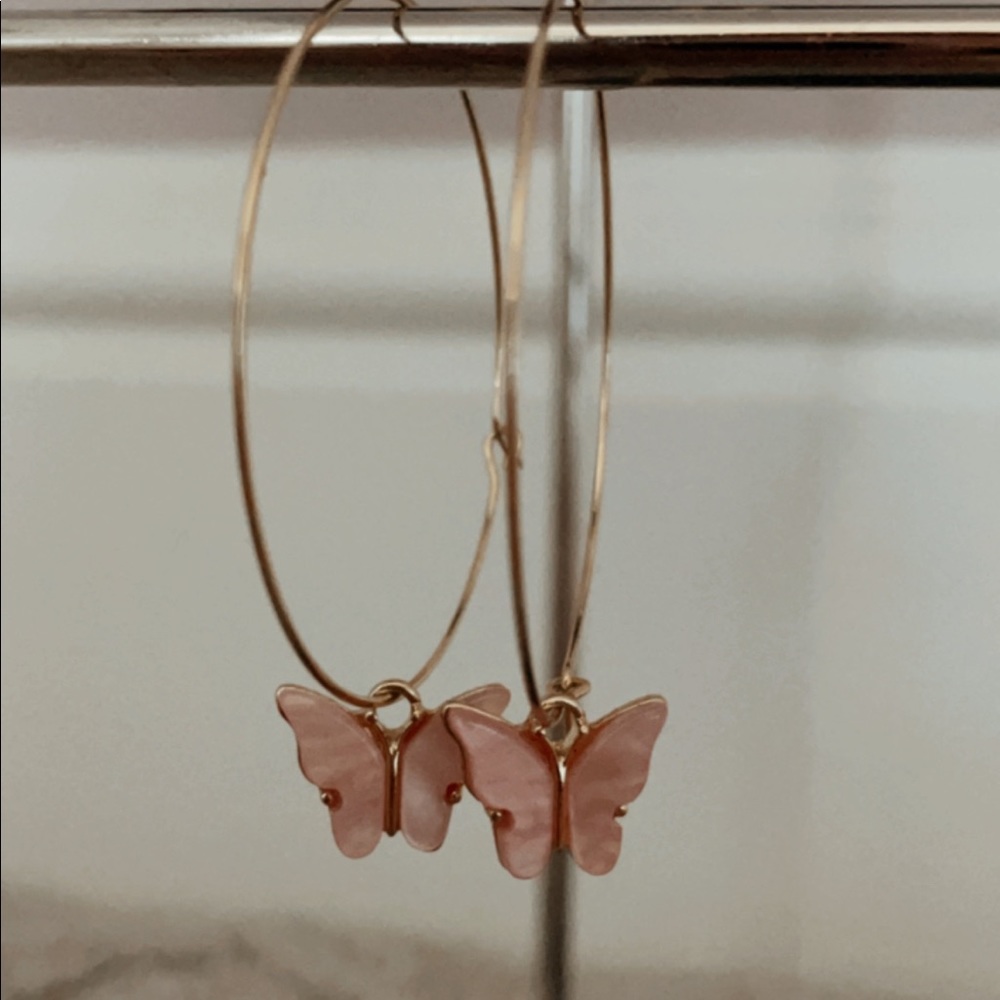 We are selling are light pink butterfly earrings